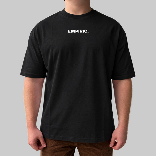 STRESS BUILDS. Tee in Black, front, on the model. Model wears XL • 5'11" • 216 lb