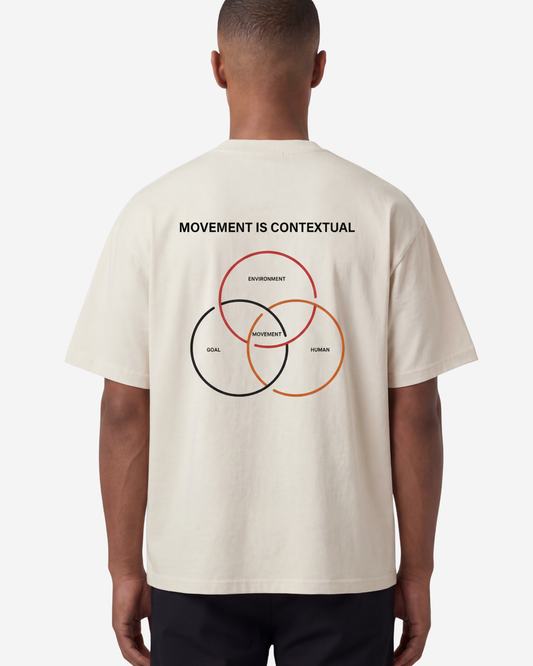 EMPIRIC. MOVEMENT IS CONTEXTUAL tee — front view, French Oak garment-dyed heavyweight cotton