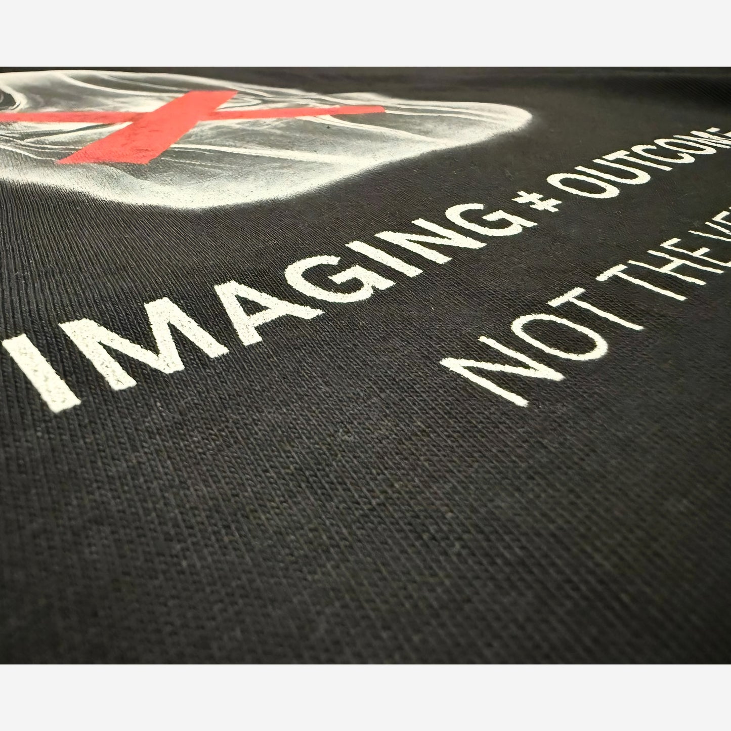EMPIRIC. IMAGING ≠ OUTCOME tee — on-body lifestyle shot