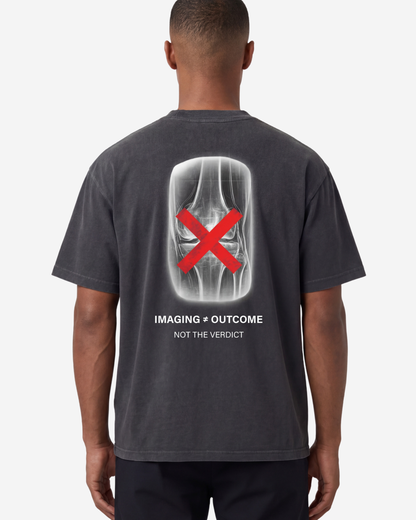 EMPIRIC. IMAGING ≠ OUTCOME tee — front view, black garment-dyed heavyweight cotton