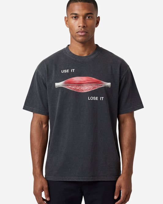 EMPIRIC. USE IT / LOSE IT tee — front view, black garment-dyed heavyweight cotton
