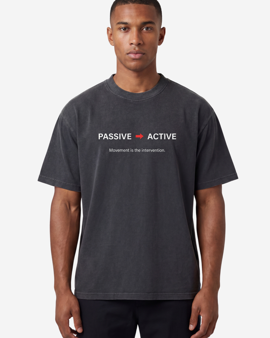 EMPIRIC. PASSIVE TO ACTIVE tee — front view, black garment-dyed heavyweight cotton