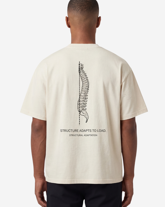 EMPIRIC. STRUCTURE ADAPTS TO LOAD tee — front view, French Oak garment-dyed heavyweight cotton