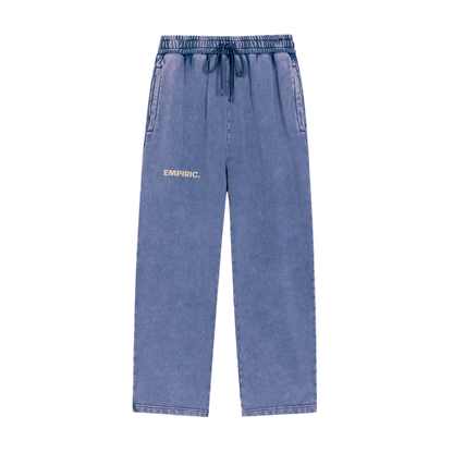 CONTROL RUNS DEEP. Snow Washed Sweatpants in Dark Blue, front, sand EMPIRIC mark on the left thigh