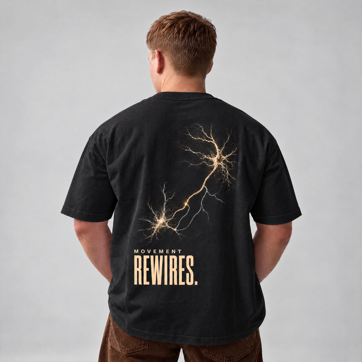 MOVEMENT REWIRES. Tee in Black, back print, on the model. Model wears XL • 5'11" • 216 lb