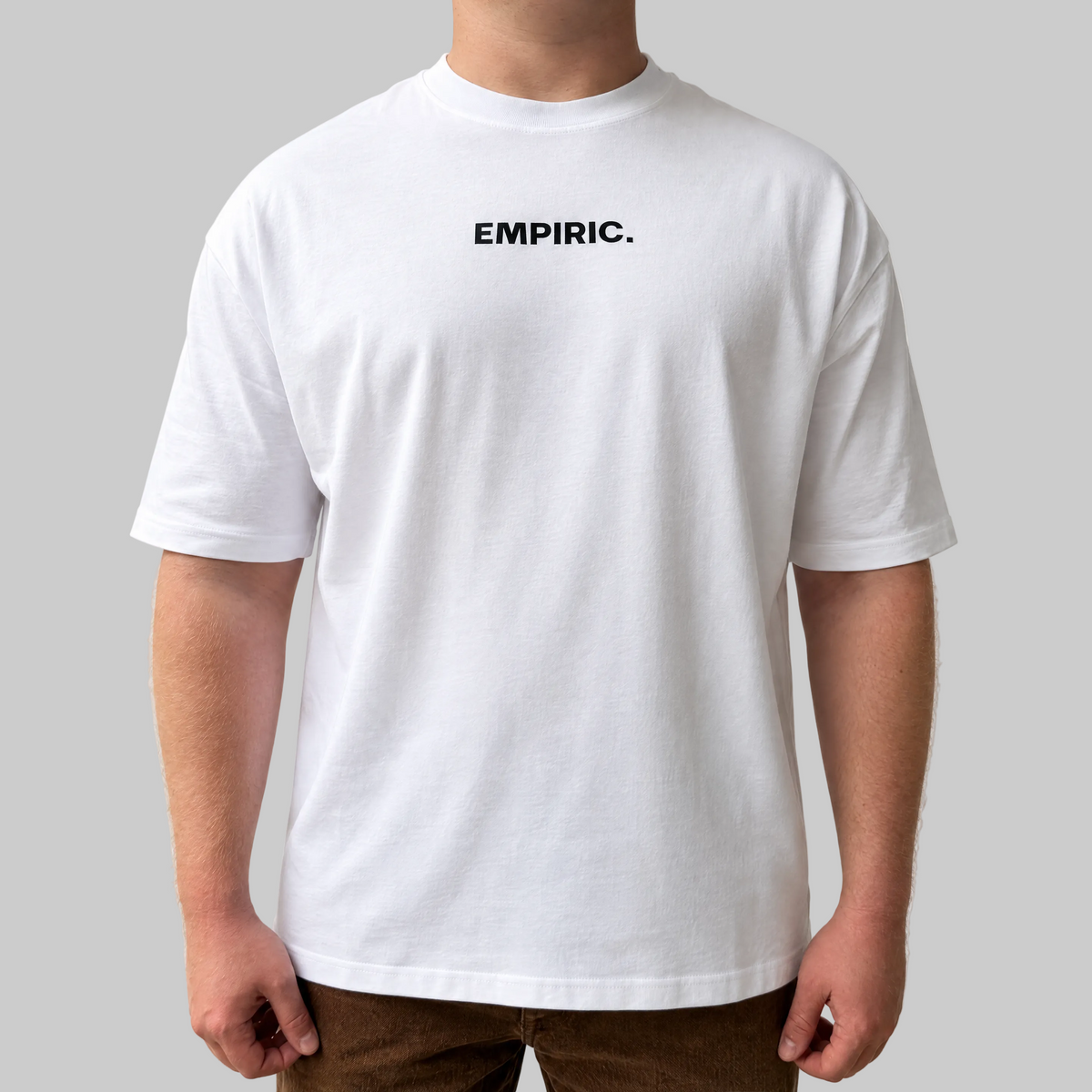 STRESS BUILDS. Tee in White, front, on the model. Model wears XL • 5'11" • 216 lb